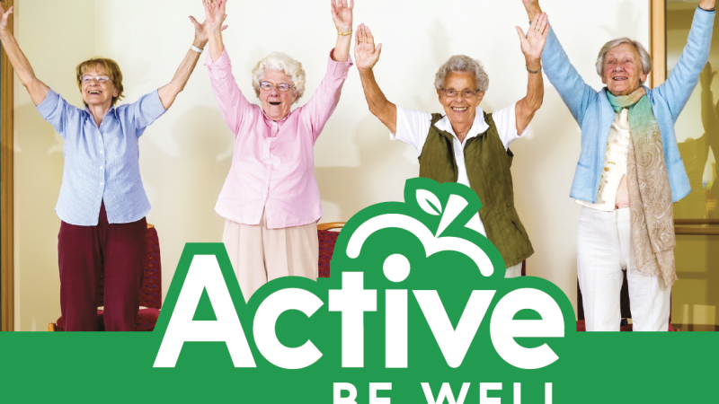 Four folder people looking joyful with the Active Be Well logo